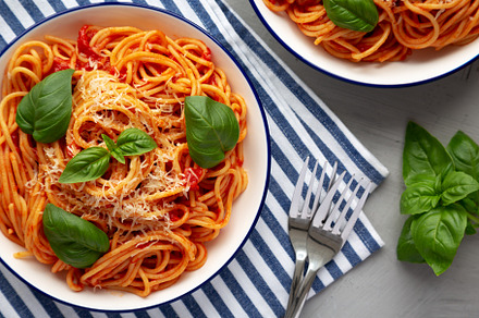 Homemade Pasta Pomodoro on a Plate, top view. Flat lay, overhead, a Food & Drink Photo by LiudmylaChuhunova