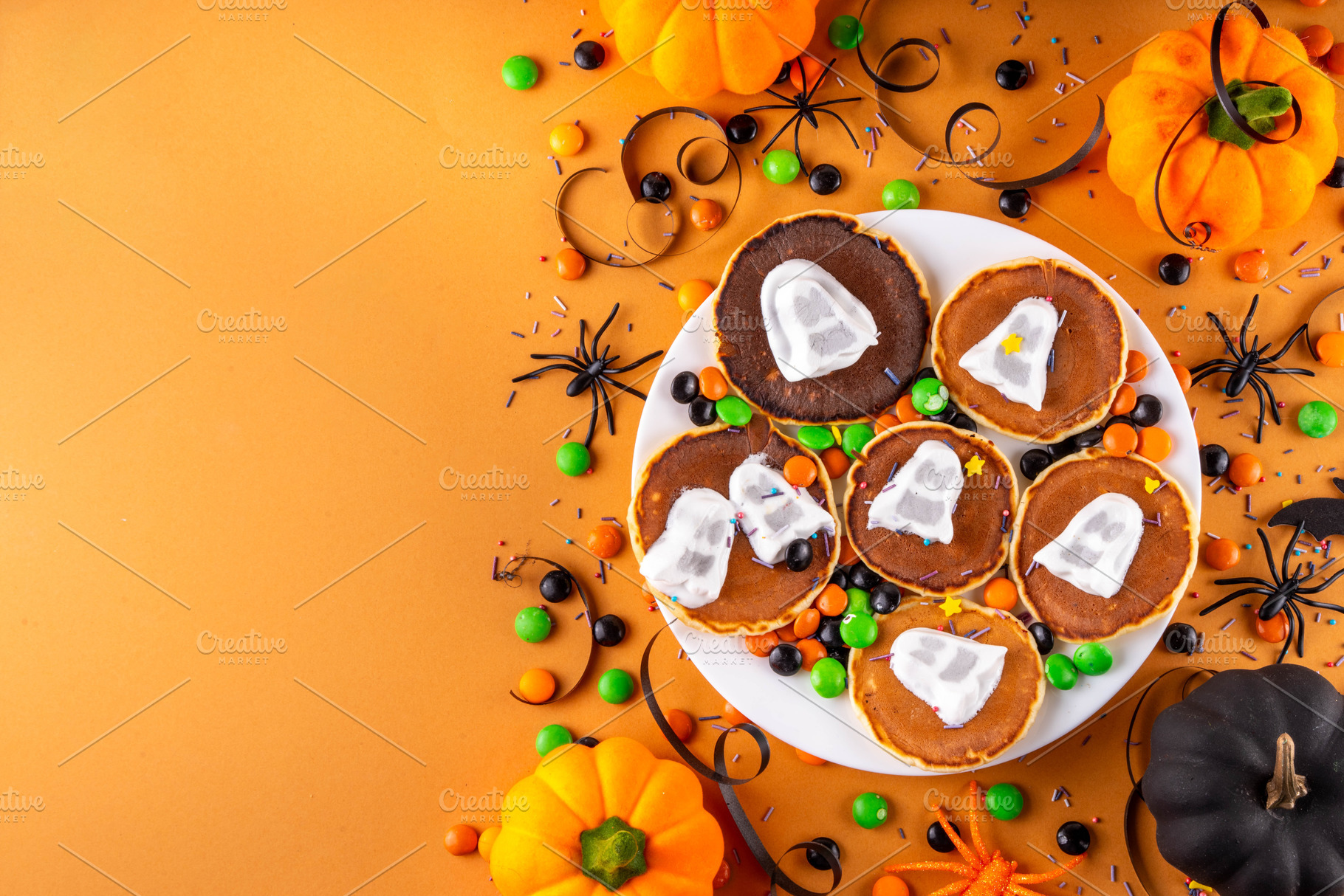 Tasty Halloween pancakes topped with marshmallow ghosts, a Food & Drink Photo by Rimma