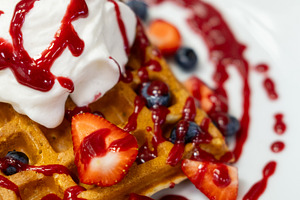 Belgian waffles sweet dish cream strawberry sauce, a Food & Drink Photo by Photo Drive Studio