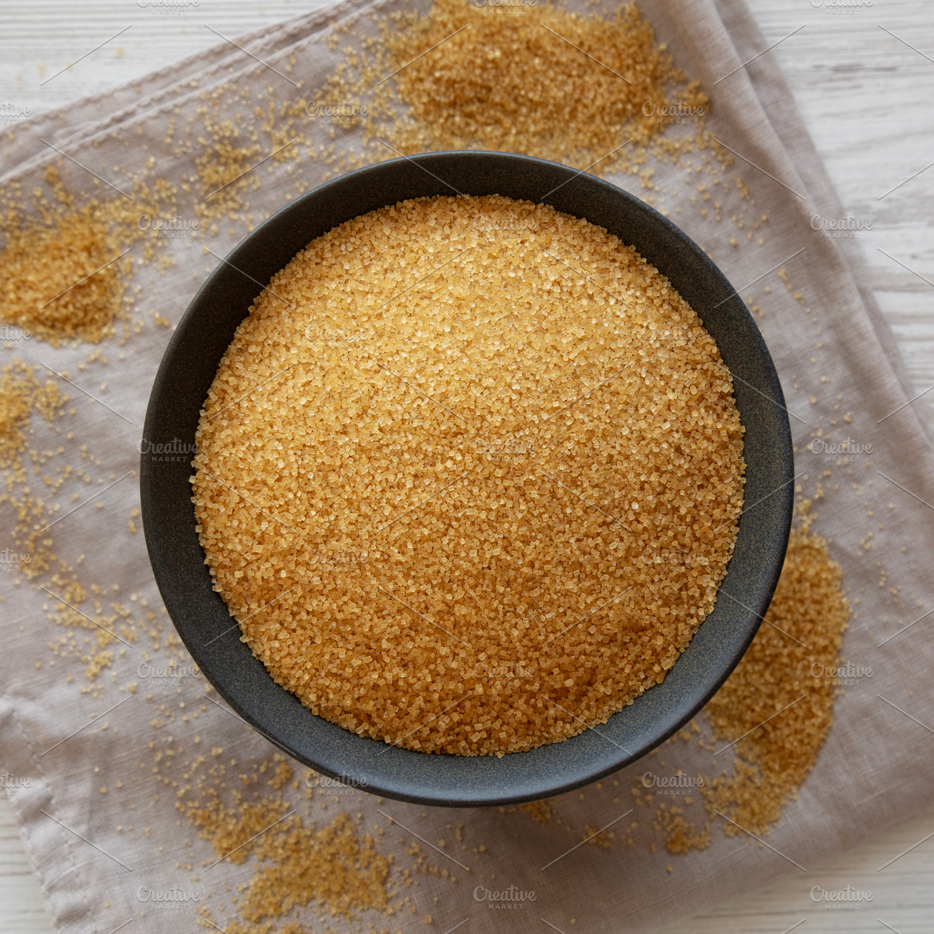 Organic Demerara Sugar in a Bowl, top view. Close-up., a Food & Drink Photo by LiudmylaChuhunova