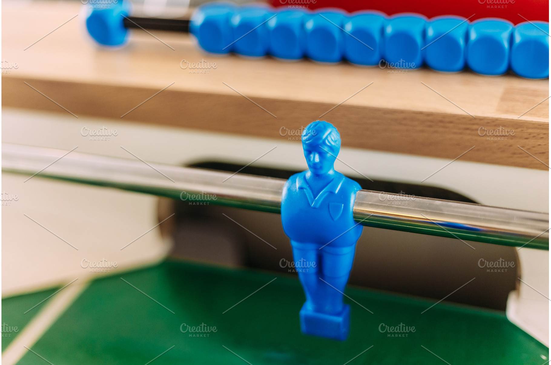 Table football game with blue player, a Sports & Recreation Photo by Our Amazing World