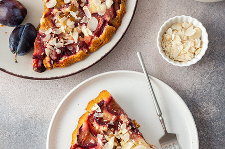 Piece of plum cake on a plate, a Food & Drink Photo by Pandateam