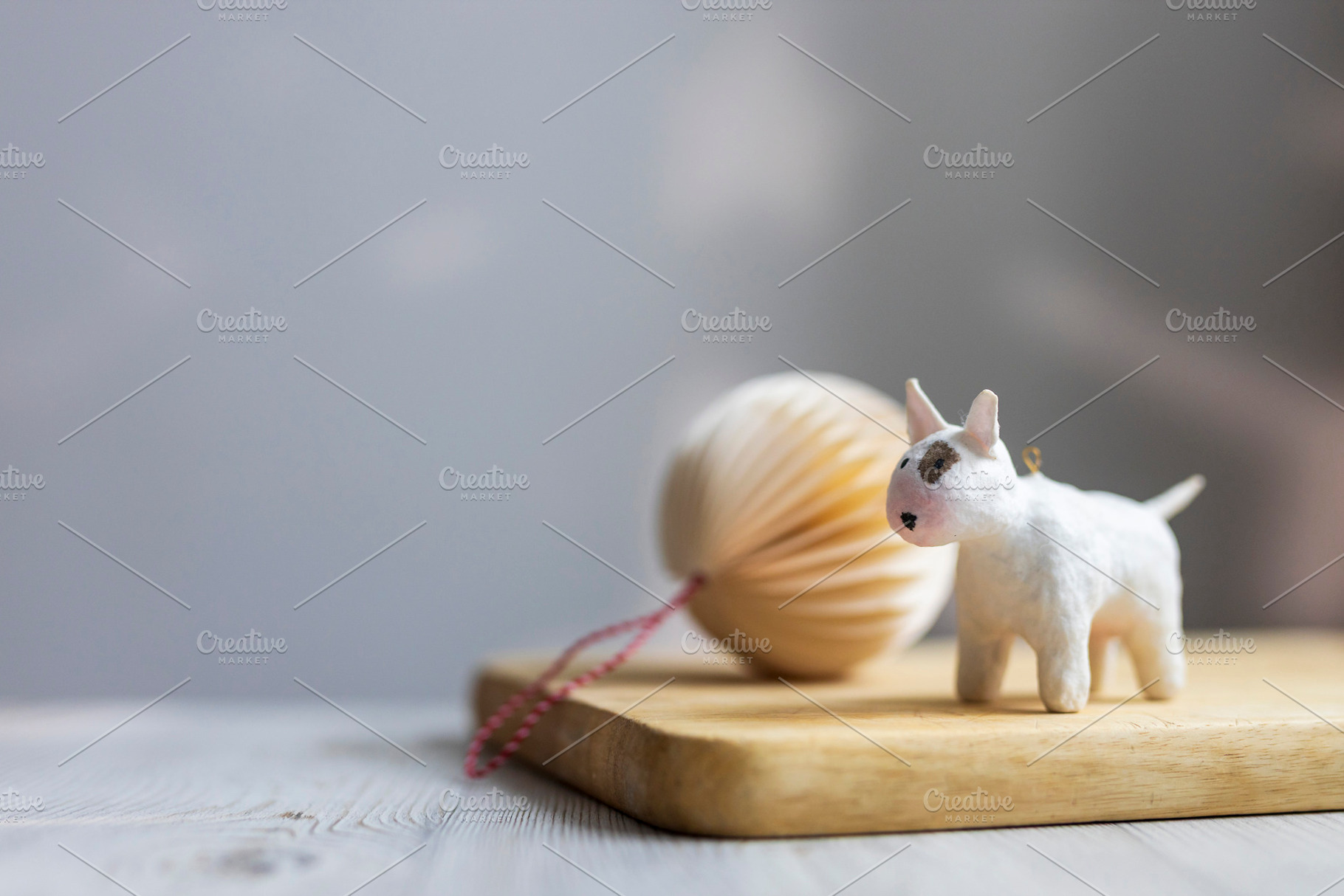 Small white bull terrier dog figurin, a Wallpaper Photo by Imaginarium
