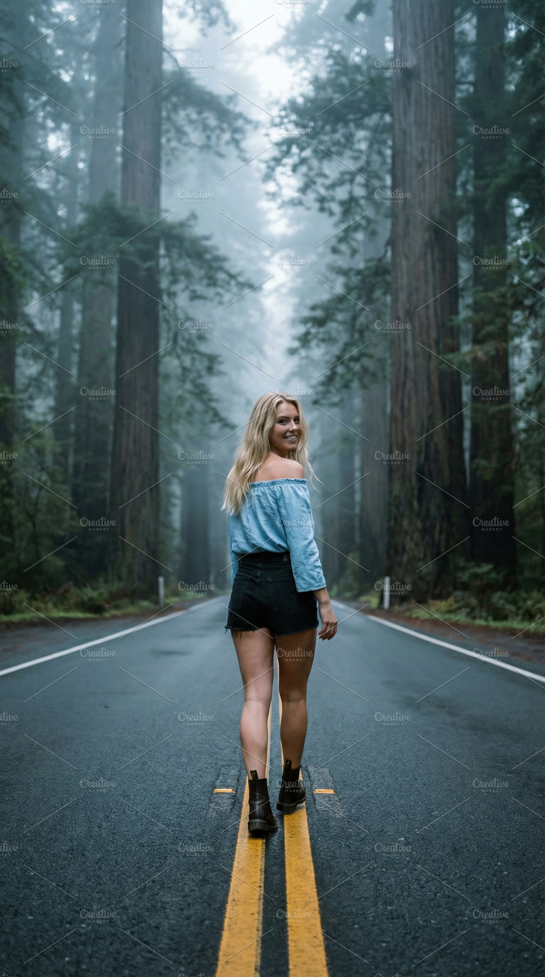 Blonde Woman Smiling on Foggy Road, a Person Photo by Virgo Studio