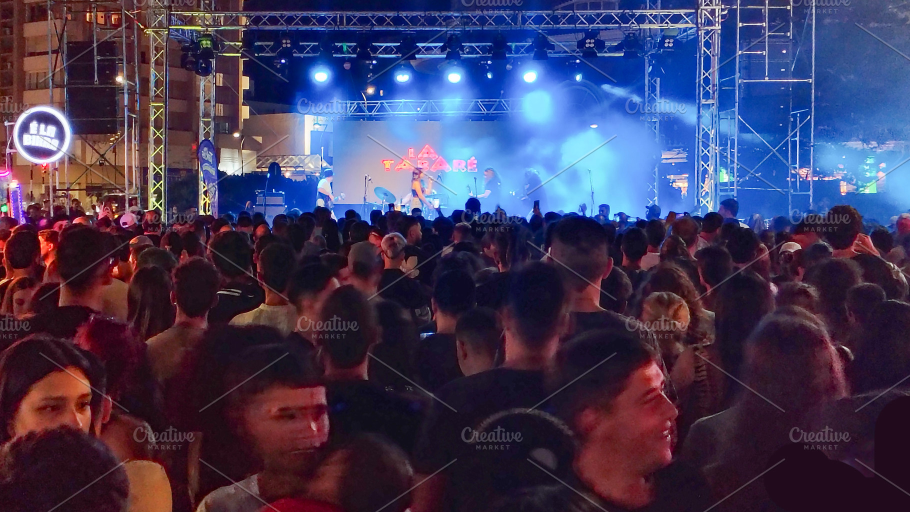 Crowd at night concert with colorful stage lighting, an Arts & Entertainment Photo by DanFLCreativo