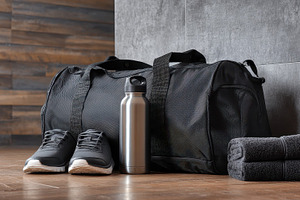 Black gym bag with water bottle, a Photo by Pavel_design