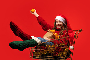 Girl in Santa hat, a Holiday Photo by Elena Vagengeim