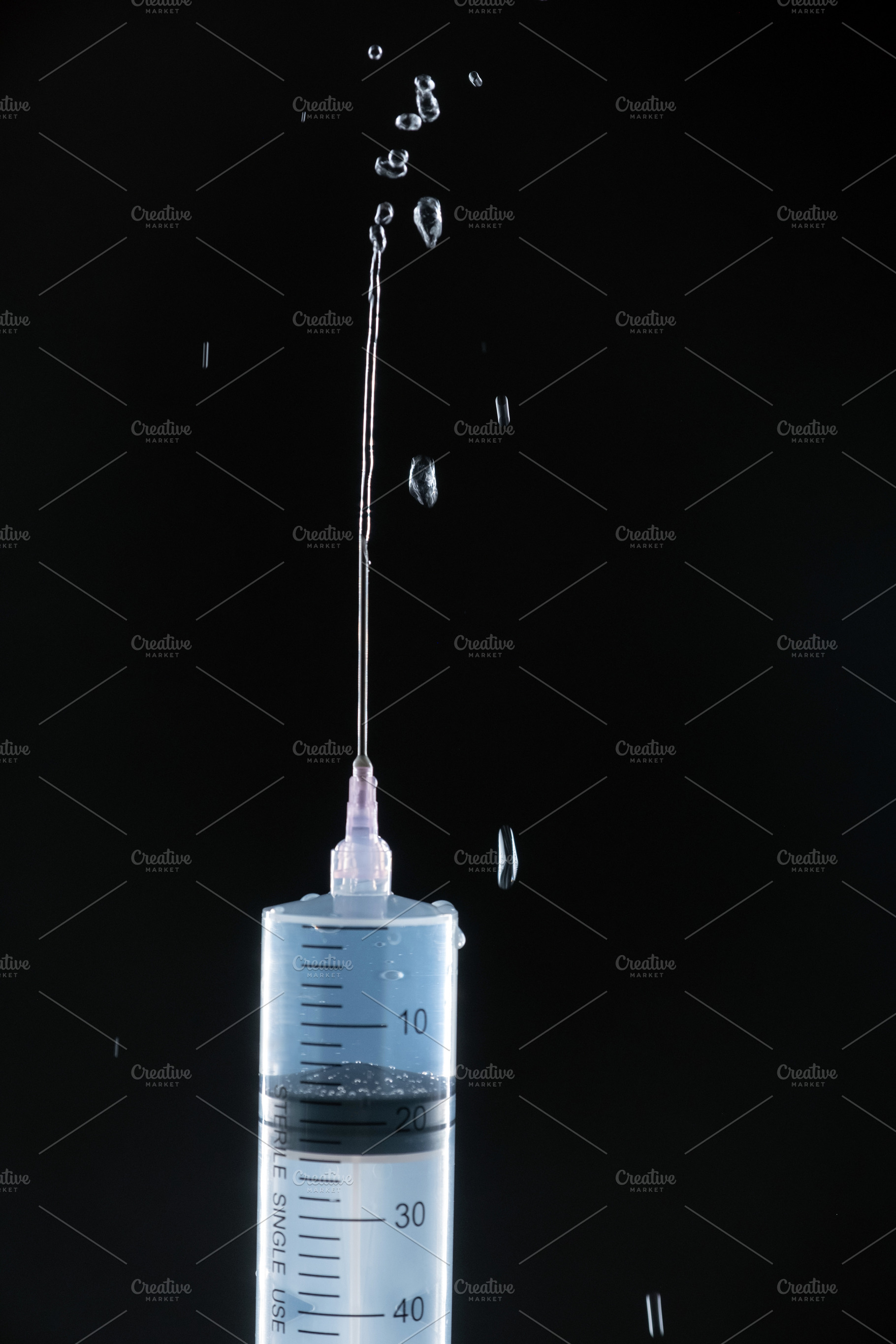 Dynamic Splash of Liquid Ejecting from a Syringe Needle., a Photo by Rohan Photography