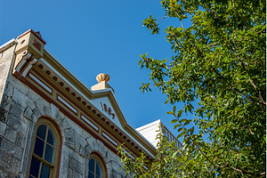 Ornate roofline showing 1884 on, an Architecture Photo by Backyard Stock