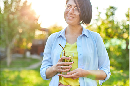Woman drinking summer citrus, a Food & Drink Photo by IlliaBondarPhotography