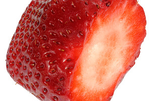 Round piece of ripe red strawberry on isolated background, a Food & Drink Photo by ndanko