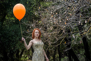 Portrait of a woman in a shiny gold, a Person Photo by Imaginarium