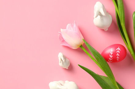 Elegant Easter vertical banner with Easter eggs, tulips, decorative rabbits on