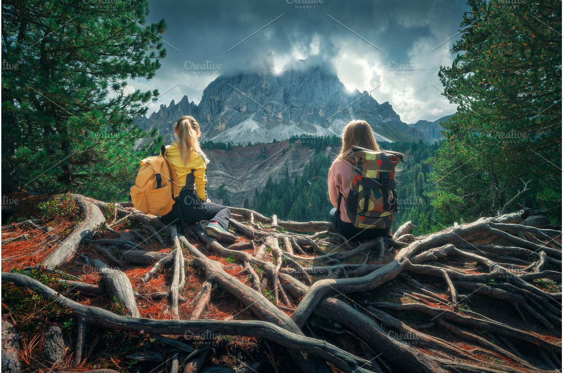 Two young women with backpacks, a Person Photo by den-belitsky