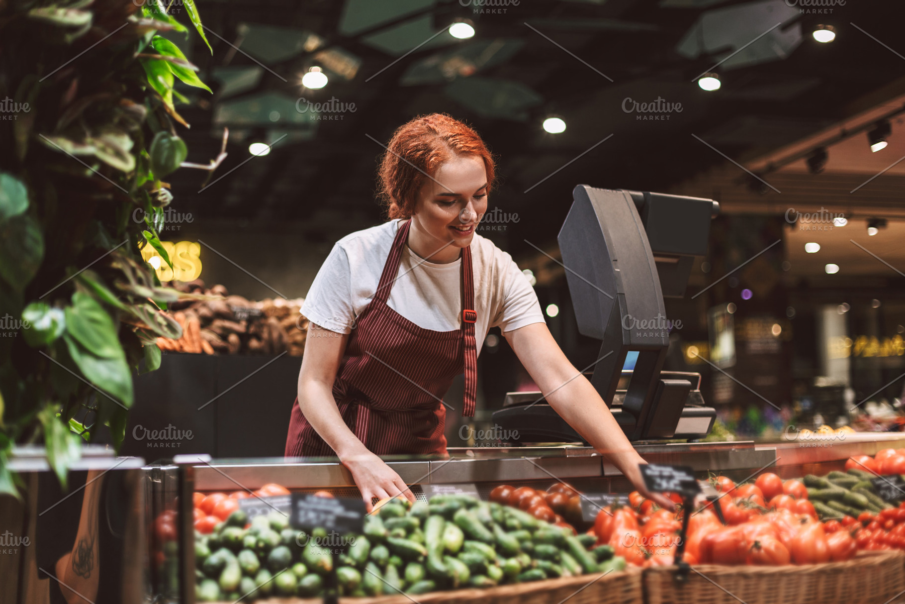 Young smiling seller in apron behind featuring enjoy, communicable, and, a Food & Drink Photo by Garetsworkshop