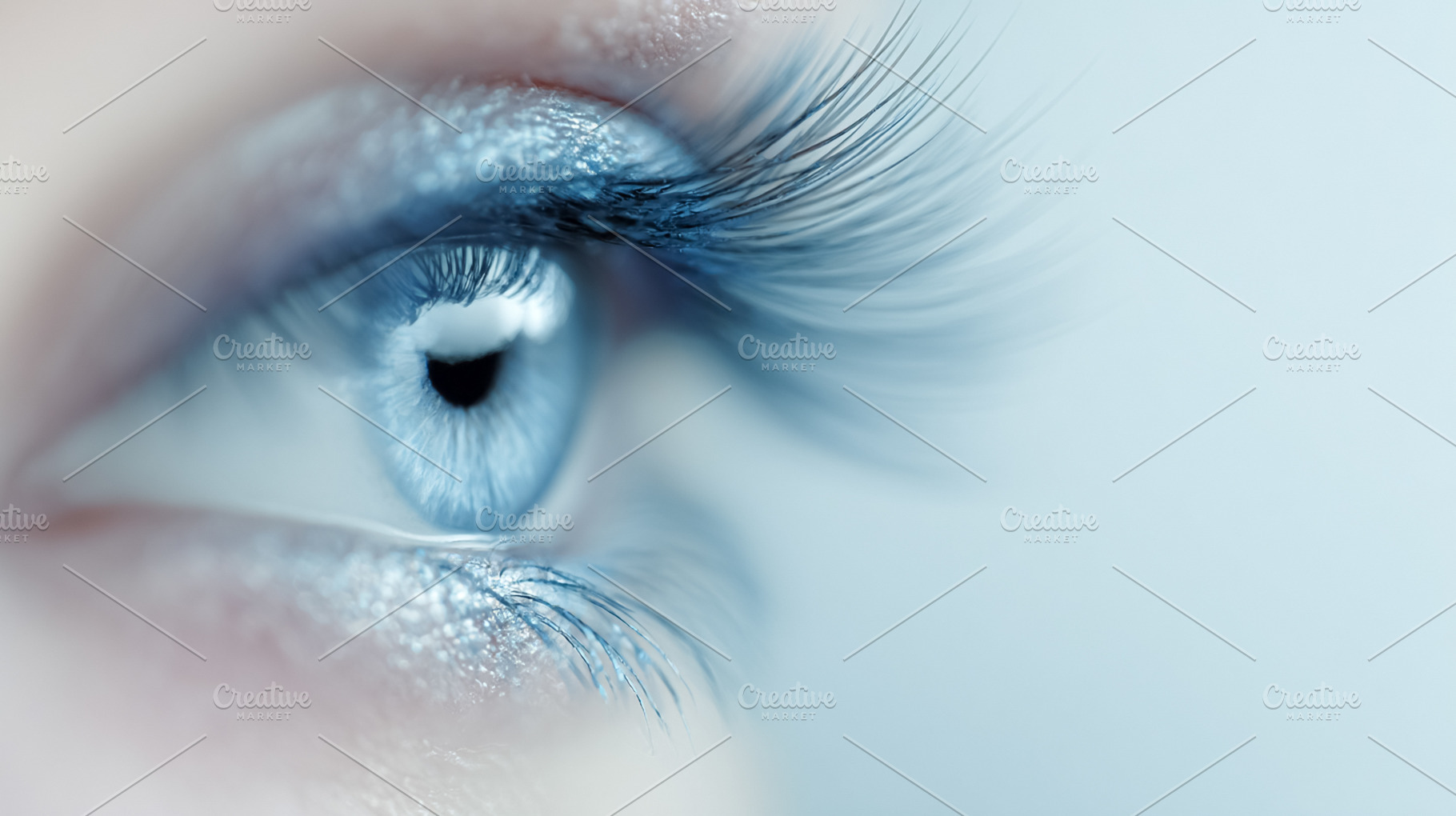 Close up of a human eye with enhanced eyelashes and bright blue, a Photo by Studio ANNA