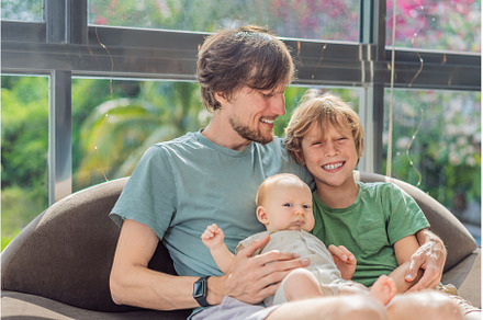 Father, son, and newborn baby