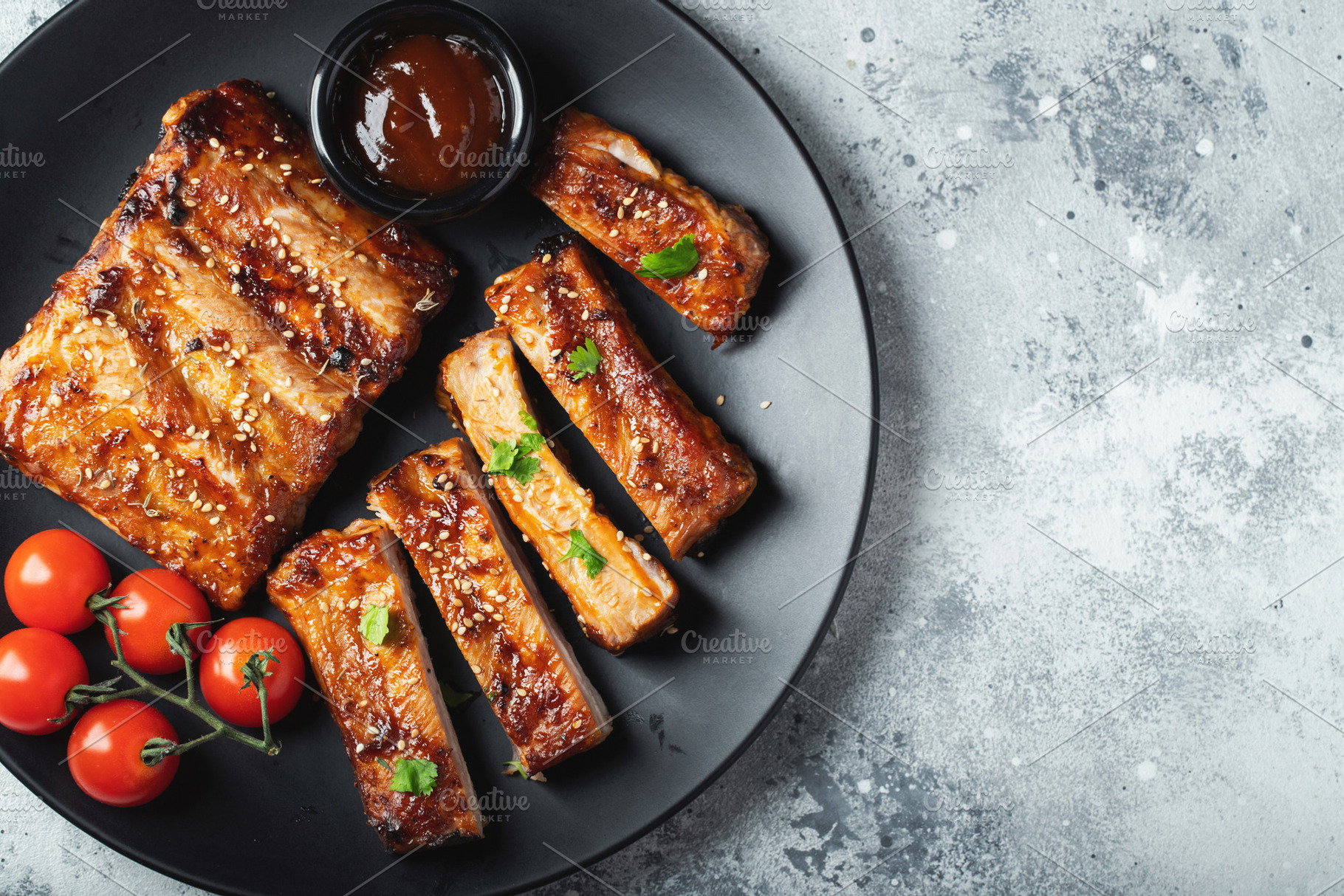 Closeup of pork ribs grilled with BBQ sauce and caramelized in honey., a Food & Drink Photo by Budarinphoto