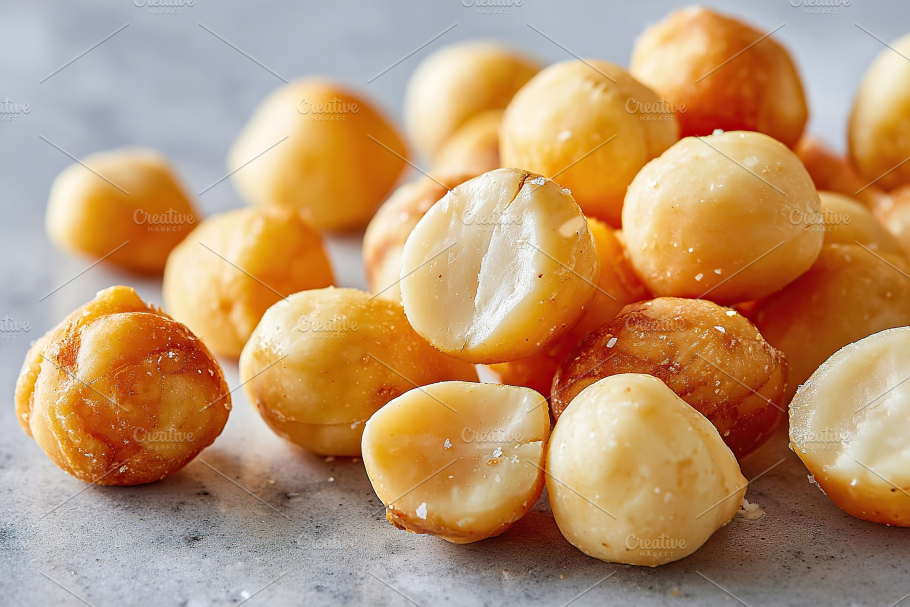 Crunchy and flavorful roasted macadamia nuts on display in bright light, a Food & Drink Photo by AlyaAnd
