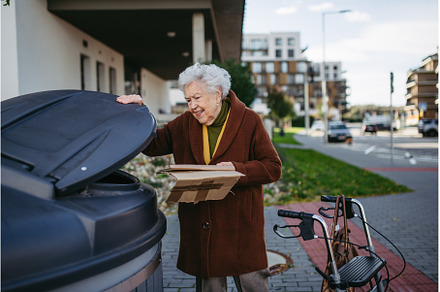 Elderly woman disposing cardboard, an Architecture Photo by HalfPoint