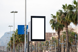 Blank vertical billboard on a city, a Business Photo by volodymyrshtun13795