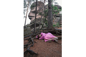 Woman in the taiga forest and rocks, a Person Photo by Jan Jack Russo Media