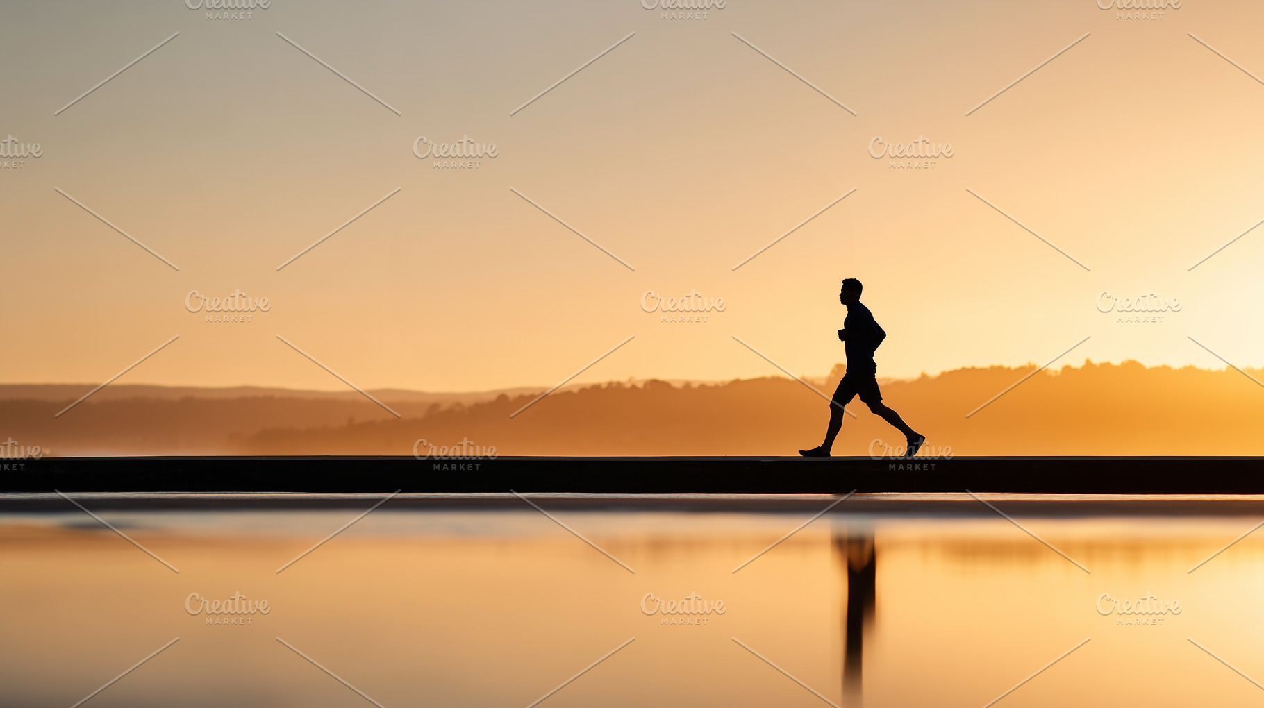 Silhouette of a man jogging along, a Person Photo by MistyDay