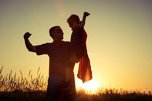 Father and son playing superhero containing active, adventure, and boy