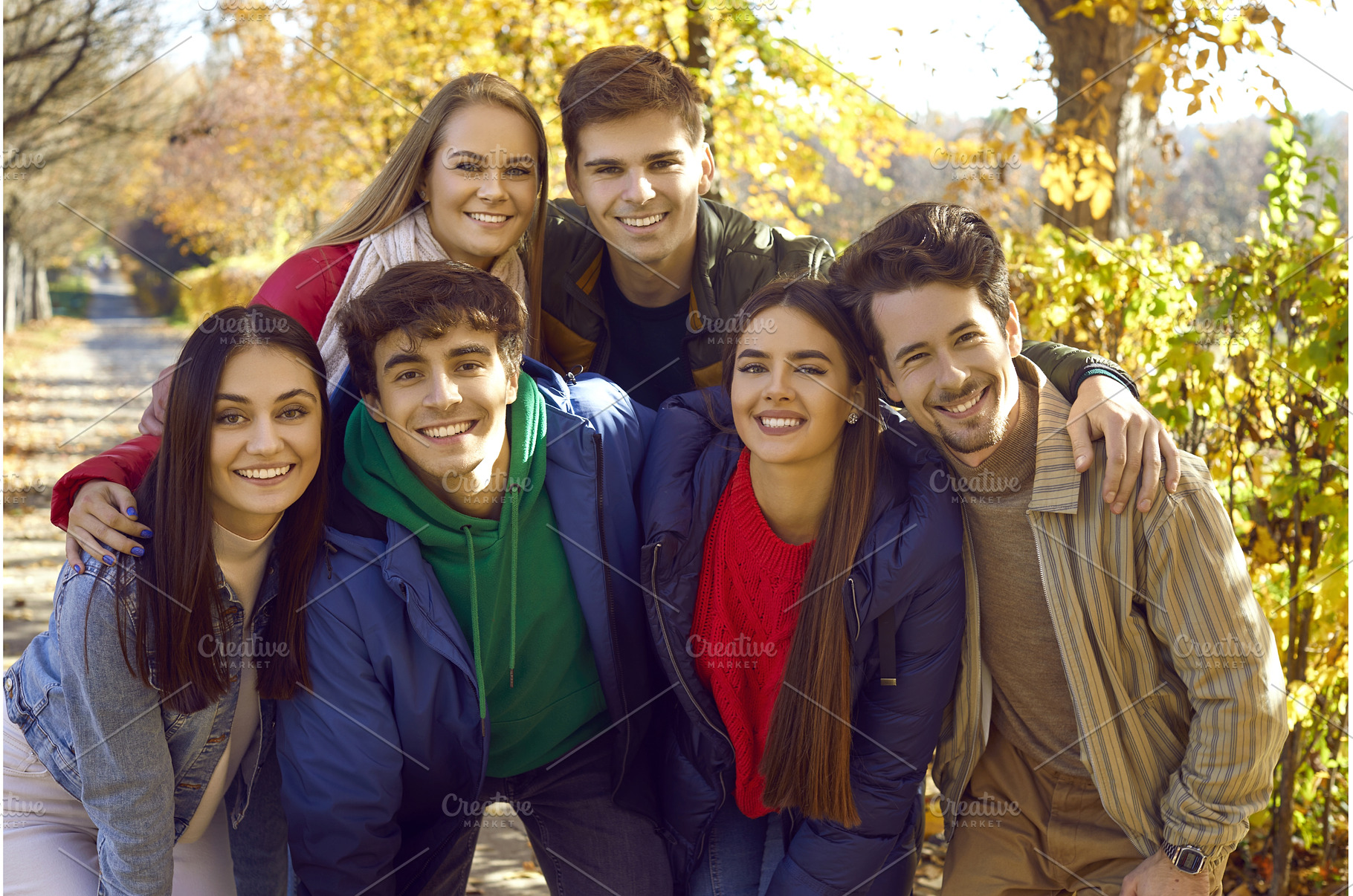 Positive young friends posing for, a Person Photo by StudioRomantic