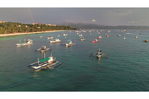 Traditional bangka boats floating, a Nature Photo by Goinyk