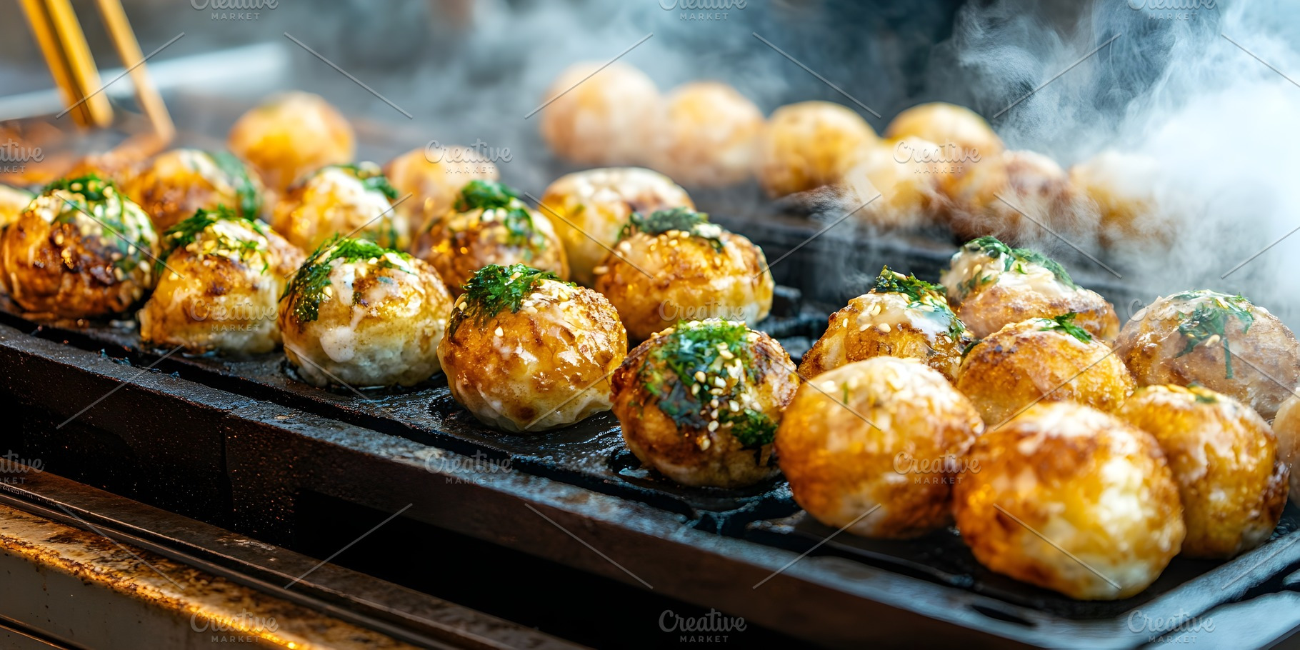 Takoyaki balls cooking on hot griddle, a Food & Drink Photo by Photostock