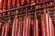 Smoked salami suspended on a rope | Food Images ~ Creative Market