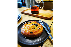 Pain suisse with raisins pastry, a Food & Drink Photo by sceptical cactus
