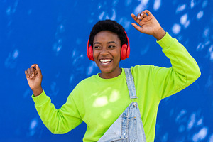 Joyful Young Black Woman Dancing, a Person Photo by Virgo Studio