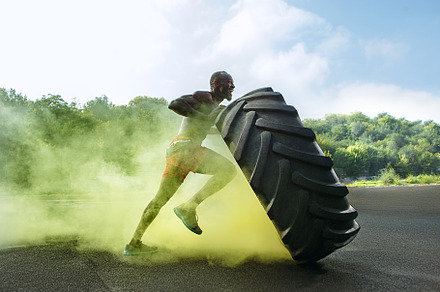 Handsome muscular man flipping big featuring tire, fitness, and athlete, a Sports & Recreation Photo by Volodymyr Melnyk