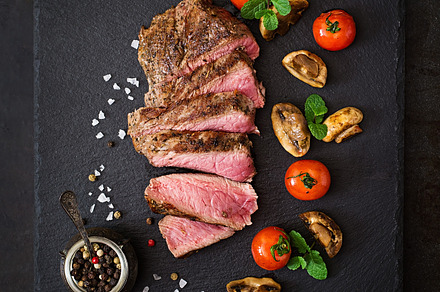 Juicy steak medium rare beef containing background, barbecue, and bbq
