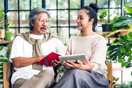 Senior couple asian family having good time using tablet compute