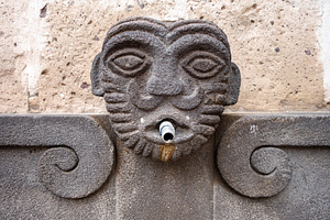 Stone face fountain in Arequipa, Peru, an Architecture Photo by GoodGoods