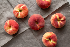 Fresh juicy ripe fig peaches, top view. Overhead, from above., a Food & Drink Photo by LiudmylaChuhunova