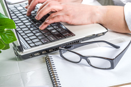 Girl typing on a laptop, a Business Photo by Rimma