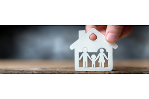 A hand shielding a family on a, a Business Photo by ZinetroN