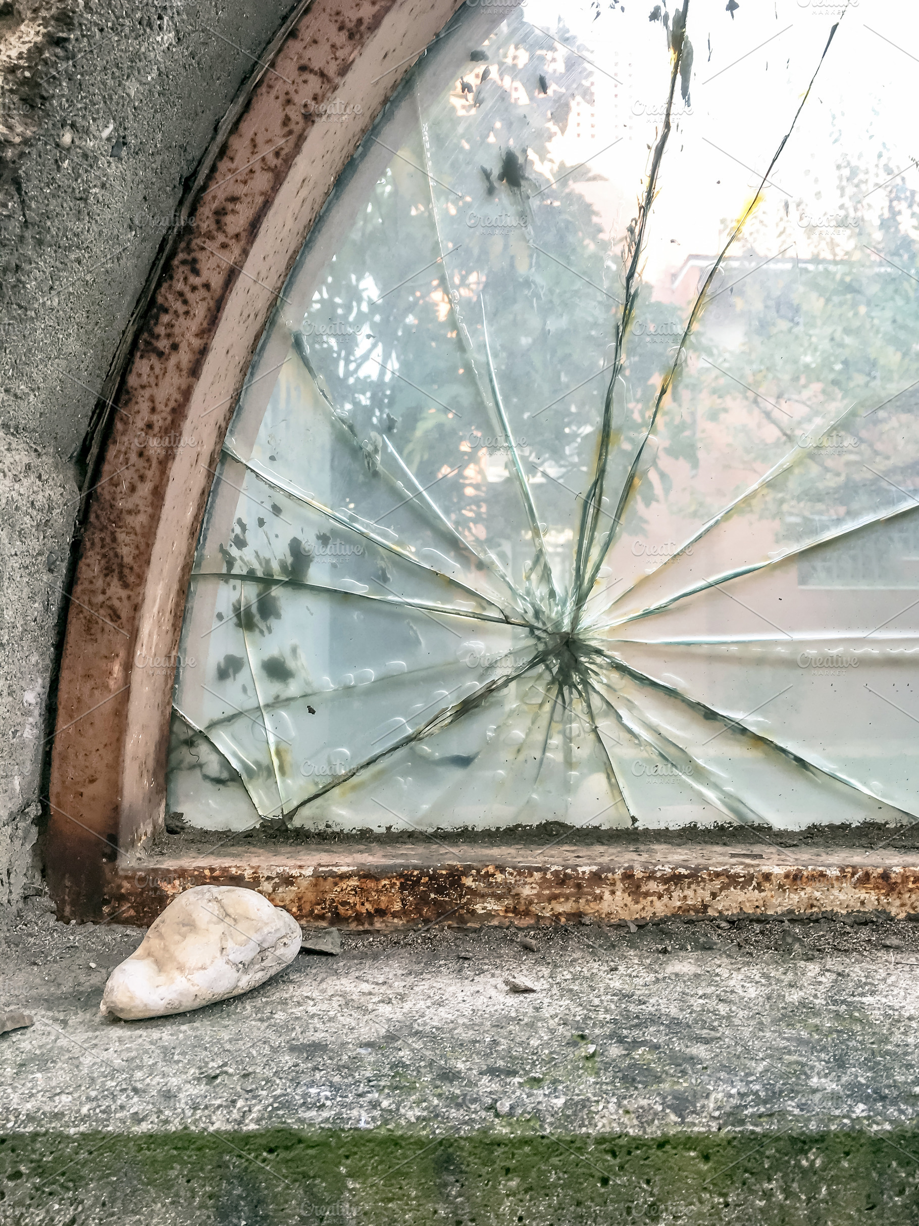 Broken glass with stone, a Wallpaper Photo by KYNA STUDIO