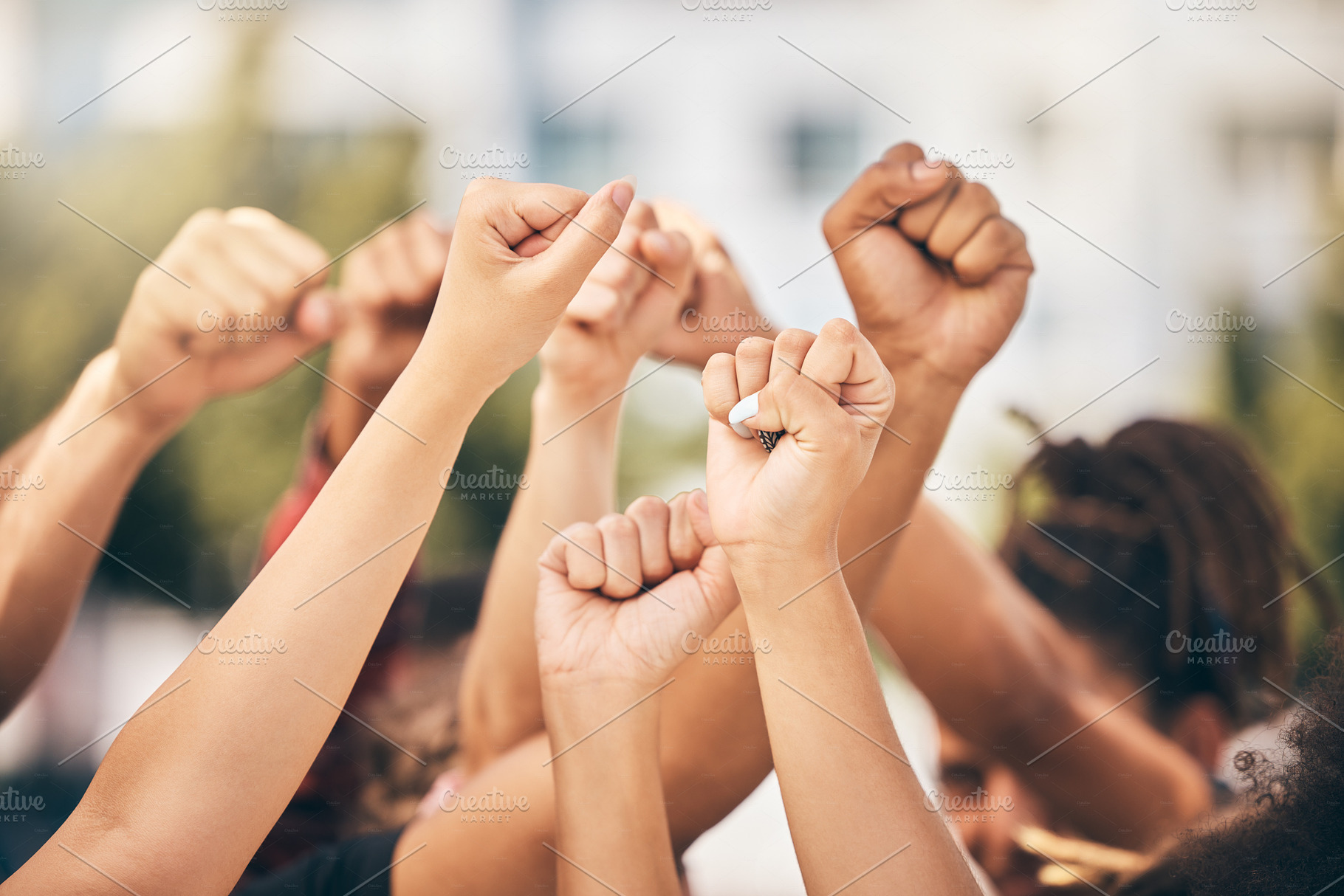 Hands, protest and community with a group of people fighting for change or human rights in the city. Freedom, collaboration and politics with a crowd standing for climate change or equality outdoor, a Photo by Peopleimages.com