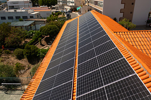 House rooftop equipped with solar panels in modern city during daytime, a Photo by andreonegin market