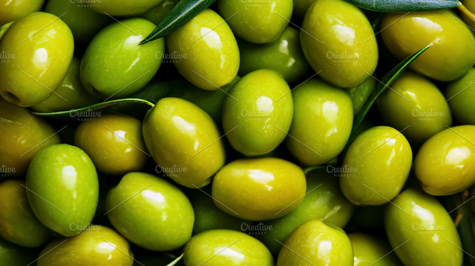 Fresh green olives background with leaves, showing healthy Medit, a Photo by Studio ANNA