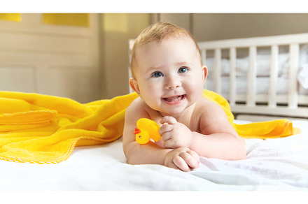 Baby after bathing in a towel, a Person Photo by yanadjana