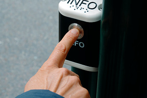 close-up of a man pressing an information button, a Photo by Nito