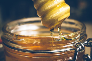 Pouring honey containing honey, food, and dinner