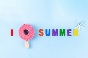 Summer vacation concept with ice cream in form of pink donut lif, a Photo by Rimma