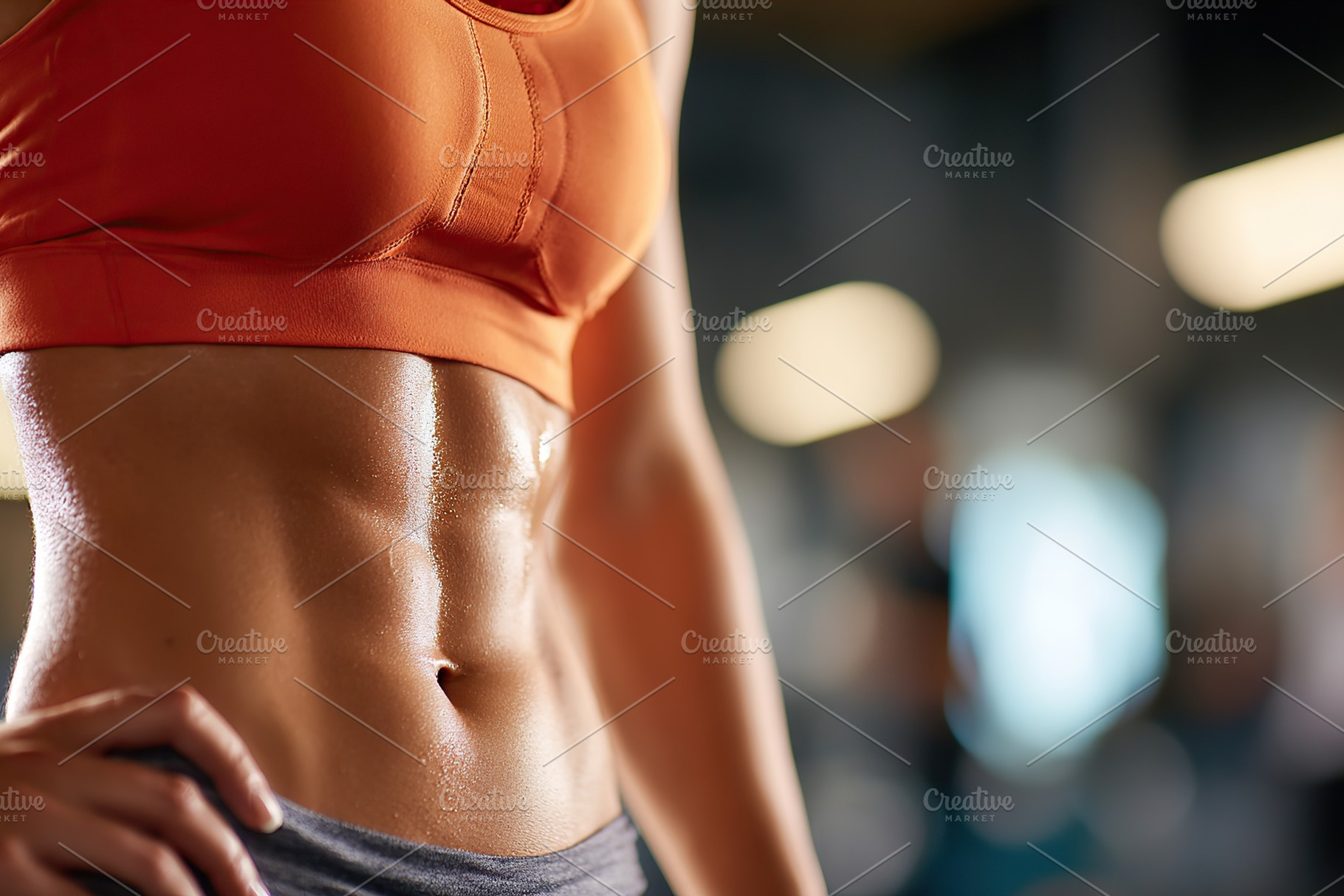 Close-up view of a fit athletic belly showcasing strength and fitness in a gym, a Sports & Recreation Photo by AlyaAnd